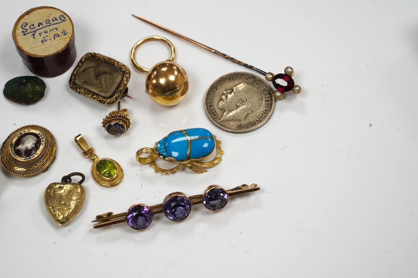 Assorted jewellery etc. including a modern 9ct gold and citrine fob, Victorian mourning brooch and a scarab beetle. Condition - poor to fair